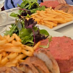 Steak tartare, frites and salad.
