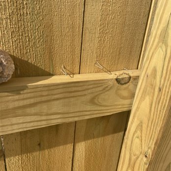 Quality Lawn Care Cares - a close up of a wooden fence - Fences & Gates Near Me Quality Lawn Care Cares - a close up of a wooden fence - Fences & Gates Near Me