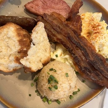 Curio Bistro - Mound of grits, eggs w/paprika, crumbly biscuit - Cajun/Creole Near Me - New Orleans, Louisiana Curio Bistro - Mound of grits, eggs w/paprika, crumbly biscuit - Cajun/Creole Near Me - New Orleans, Louisiana