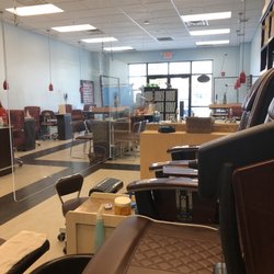 Creative Nail Studio - Safety partitions between all chairs and manicure stations.