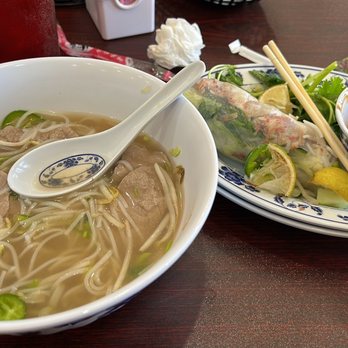 Pho Parish - Rare steak pho - regular size and pork spring rolls (2 to an order but I had already ate one). Pho comes with plate of add ins - Vietnamese Near Me - Chalmette, Louisiana