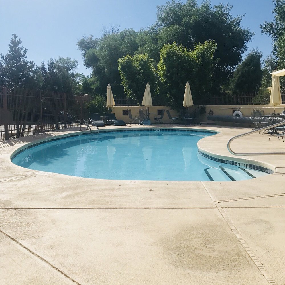 El Pueblo Lodge - Kidney/half moon style pool 5 feet deep is heated all year round... - Hotels Near Me - Taos, New Mexico