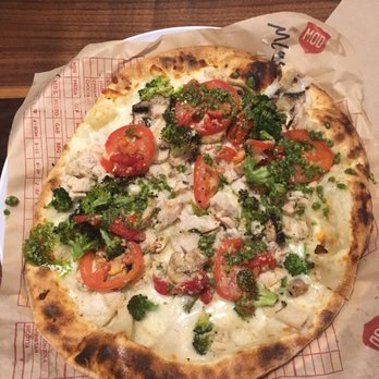 MOD Pizza - 11 inch pizza with mozzarella, parmesan, chicken, broccoli, mushrooms, red peppers, and tomatoes with a pesto drizzle! - Fast Food Near Me - The Woodlands, Texas MOD Pizza - 11 inch pizza with mozzarella, parmesan, chicken, broccoli, mushrooms, red peppers, and tomatoes with a pesto drizzle! - Fast Food Near Me - The Woodlands, Texas