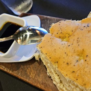 Black Trumpet Bistro - Fresh baked bread served with a balsamic vinegarette - Italian Near Me - Brookings, Oregon Black Trumpet Bistro - Fresh baked bread served with a balsamic vinegarette - Italian Near Me - Brookings, Oregon