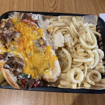 The End Zone Bar & Grill - Smothered steak with curly fries - Sports Bars Near Me - Liverpool, New York The End Zone Bar & Grill - Smothered steak with curly fries - Sports Bars Near Me - Liverpool, New York