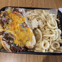 The End Zone Bar & Grill - Smothered steak with curly fries