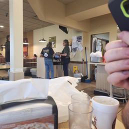 a person taking a picture of their food a person taking a picture of their food