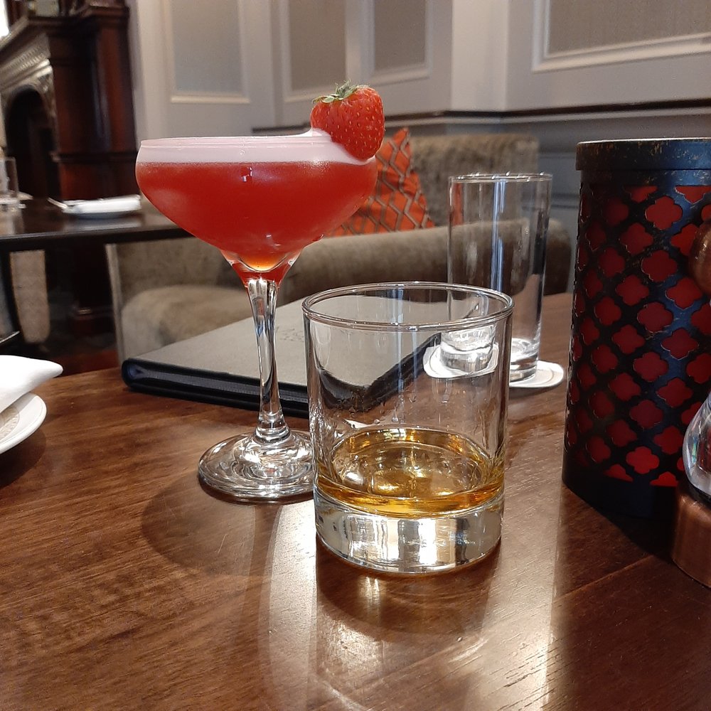 I don't remember what the cocktail was, but it was the prettiest one I've ever had. Delicious too I don't remember what the cocktail was, but it was the prettiest one I've ever had. Delicious too