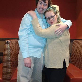 Gobi Mongolian Grill - Seating benches in the background and a happy couple ready to eat - Mongolian Near Me - Southington, Connecticut Gobi Mongolian Grill - Seating benches in the background and a happy couple ready to eat - Mongolian Near Me - Southington, Connecticut