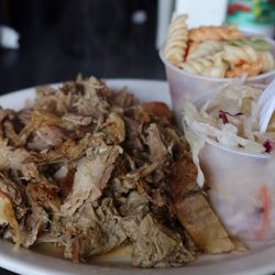 Pulled pork plate with 2 sides: coleslaw and pasta salad. 2 sauces: sweet and spicy. Very delish Lots of serving. Disposable dinnerware.