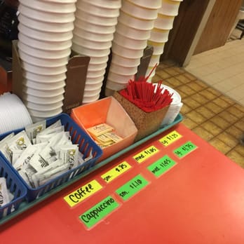Daylight Donuts - a display of donuts and coffee cups - Bakeries Near Me - Winfield, Kansas Daylight Donuts - a display of donuts and coffee cups - Bakeries Near Me - Winfield, Kansas
