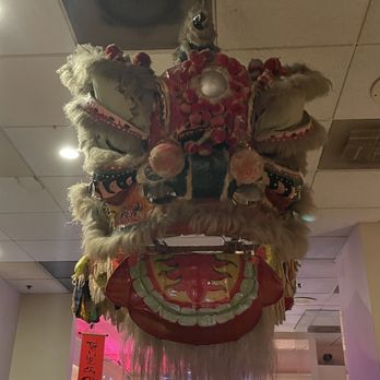 Duc's Bistro - Lion's head hanging in the bar area - French Near Me - Honolulu, Hawaii