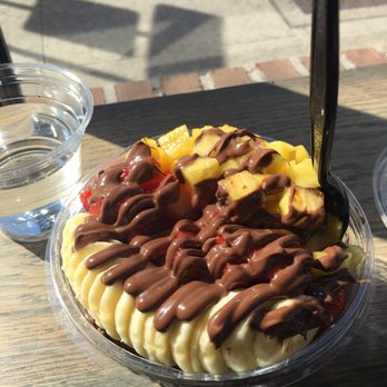 Cafe Nune - Açaí bowl with bananas, strawberries, pineapple, almond coconut granola with Nutella drizzle. - Juice Bars & Smoothies Near Me - Dunellen, New Jersey Cafe Nune - Açaí bowl with bananas, strawberries, pineapple, almond coconut granola with Nutella drizzle. - Juice Bars & Smoothies Near Me - Dunellen, New Jersey