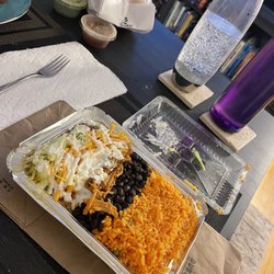 Dora Taqueria - Burrito bowl with Carnitas with chips, salsa, and guac to go.