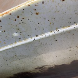 Tandy Leather - Spots where the dye left flakes. Old dye