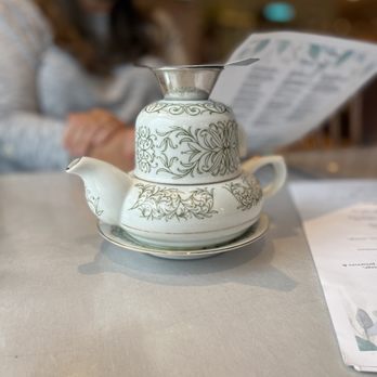 PEI Preserve - a teapot on a table with a woman in the background - Bakeries Near Me - New Glasgow, Prince Edward Island