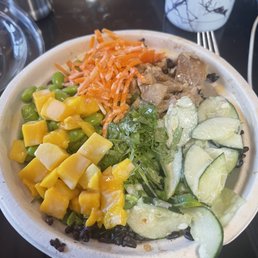 Forbidden rice, chicken, cucumber, edamame, carrots, cilantro and yum yum sauce