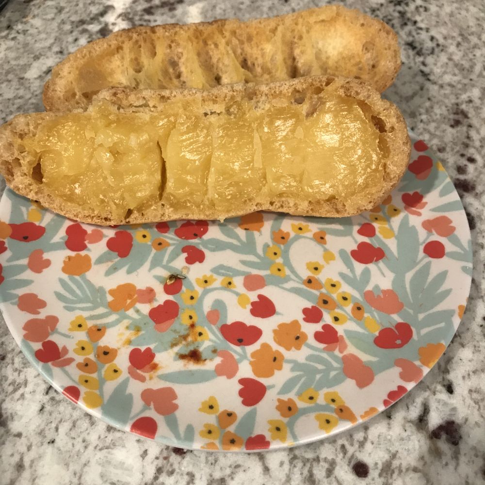 The eclair custard.  Old custard and very little.  Should be creamy.