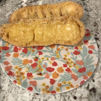 la Madeleine - The eclair custard.  Old custard and very little.  Should be creamy. - Bakeries Near Me - Lake Jackson, Texas