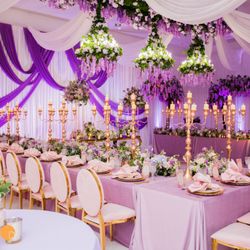 Kat's Karts - Table settings, chairs, linens, candles, flowers for a wedding.