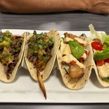 Taqueria 27 - On left, carne asada tacos, on the right pork belly tacos - Tacos Near Me - Eagle Mountain, Utah Taqueria 27 - On left, carne asada tacos, on the right pork belly tacos - Tacos Near Me - Eagle Mountain, Utah