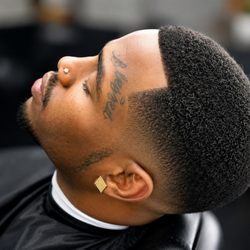 Damon’s Barber & Beauty Shop - Sharp taper fade finished with clean edge work and precision detailing