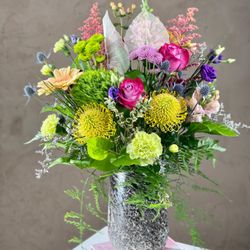 Florida Flowers - Lush flower arrangement in beautiful textured vase.