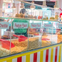 a display of popcorn at a carnival a display of popcorn at a carnival