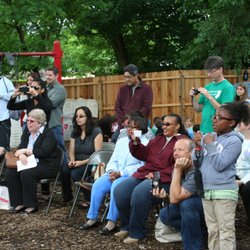 Cradles To Crayons - Parents watching a graduation
