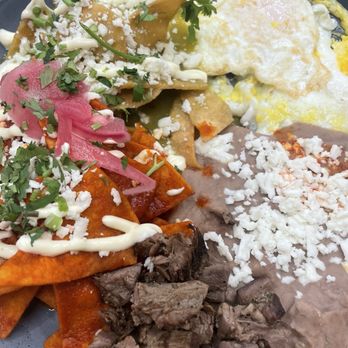 Nidito Cocina - Chilaquiles divorciados with beef fajita. The tomatillo salsa was nice and acidic. - Breakfast & Brunch Near Me - Stafford, Texas Nidito Cocina - Chilaquiles divorciados with beef fajita. The tomatillo salsa was nice and acidic. - Breakfast & Brunch Near Me - Stafford, Texas