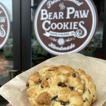 Bear Paw Cookies - a hand holding a chocolate chip cookie - Desserts Near Me - Coeur d'Alene, Idaho