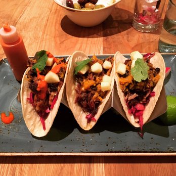 Little Beet Table - Quite possibly the perfect tacos. (Pork carnitas tacos). Also note the taco holder, very important for soft taco integrity. - New American Near Me - New York, New York Little Beet Table - Quite possibly the perfect tacos. (Pork carnitas tacos). Also note the taco holder, very important for soft taco integrity. - New American Near Me - New York, New York