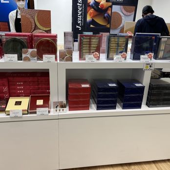 J Sweets - a display of various types of chocolates - Desserts Near Me - Burnaby, British Columbia