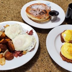 Los Amigos Diner & Restaurant  - Chocolate chip pancakes, corned beef hash plate (hash is under the eggs) and latke eggs benedict