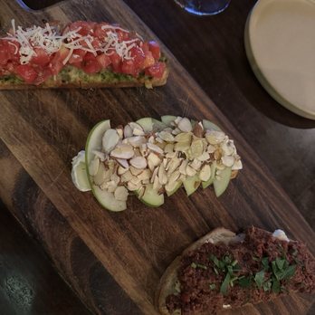 Sugo Trattoria - Bruschetta Trio: left to right (the classic, apple/brie/honey/almonds, olive/goat cheese) - Italian Near Me - Petaluma, California Sugo Trattoria - Bruschetta Trio: left to right (the classic, apple/brie/honey/almonds, olive/goat cheese) - Italian Near Me - Petaluma, California