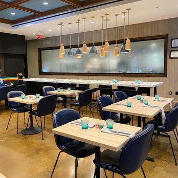 Local Motives - a restaurant with tables and chairs - New American Near Me - Atlanta, Georgia Local Motives - a restaurant with tables and chairs - New American Near Me - Atlanta, Georgia