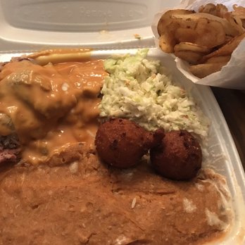 Dukes Barbecue - To-go barbecue plate (BBQ, coleslaw, hush puppies, rice and hash) with homemade chips - Barbeque Near Me - Walterboro, South Carolina