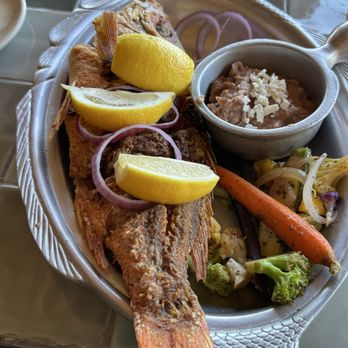 Solomon's Landing - Whole fried red snapper with vegetables and refried beans - Seafood Near Me - Cabo San Lucas, BCS Solomon's Landing - Whole fried red snapper with vegetables and refried beans - Seafood Near Me - Cabo San Lucas, BCS
