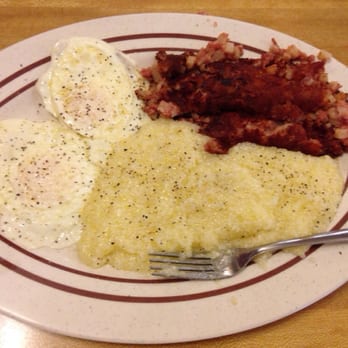 Colonial Room - 2 eggs over medium, corned beef hash, and grits. Yumm my favorite. - American Near Me - Sanford, Florida Colonial Room - 2 eggs over medium, corned beef hash, and grits. Yumm my favorite. - American Near Me - Sanford, Florida