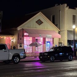 The Cake Bar - Store front at night