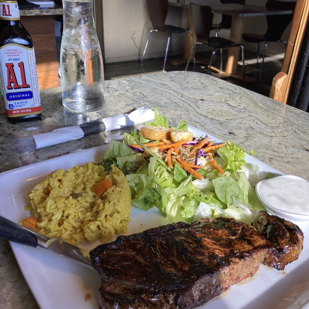 The Mesquitery - This is the NY Strip steak with two sides. It was a medium well and it was very good. The salad and the rice went perfect with the steak - Seafood Near Me - Hood River, Oregon The Mesquitery - This is the NY Strip steak with two sides. It was a medium well and it was very good. The salad and the rice went perfect with the steak - Seafood Near Me - Hood River, Oregon