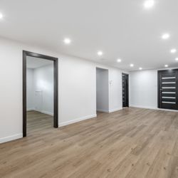 Urban Edge Construction & Remodeling - Luxury vinyl plank flooring installation in finished basement -- Cedar Rapids remodeling contractor.