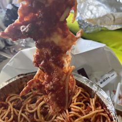 Spaghetti and thick blanket of cold cheese