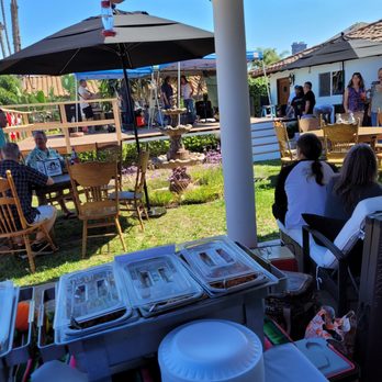 Taco and Catering - a group of people sitting outside - Caterers Near Me Taco and Catering - a group of people sitting outside - Caterers Near Me