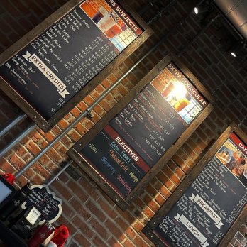 Schoolhouse 7 Cafe - menus on brick wall - Cafes Near Me - Fishers, Indiana