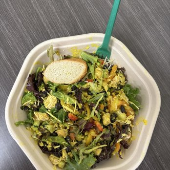 Greenbeat - Mixed green salad with roasted chicken and mango vinaigrette dressing. PS...bread is delicious! - Salad Near Me - Orlando, Florida Greenbeat - Mixed green salad with roasted chicken and mango vinaigrette dressing. PS...bread is delicious! - Salad Near Me - Orlando, Florida