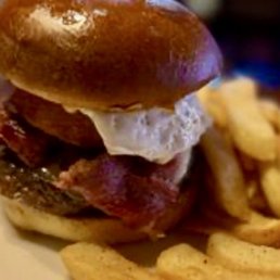 Hangover Burger (cooked medium, Bacon, Onion Ring, fried egg, and cheese), with steak fries. Hangover Burger (cooked medium, Bacon, Onion Ring, fried egg, and cheese), with steak fries.