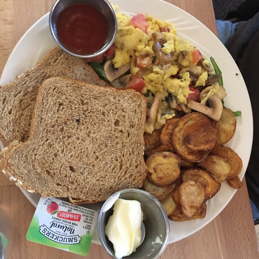 Van Gogh's Eeterie - Mushroom scramble with tomato on a bed of baby spinach... - Breakfast & Brunch Near Me - Springfield, Missouri