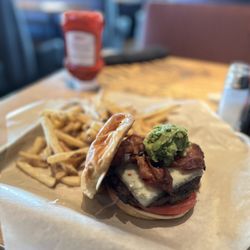 BJ's Restaurant & Brewhouse - Bacon-Guacamole Deluxe Burger* and Fries