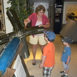 Museum docent giving kids tour at China Lake Museum